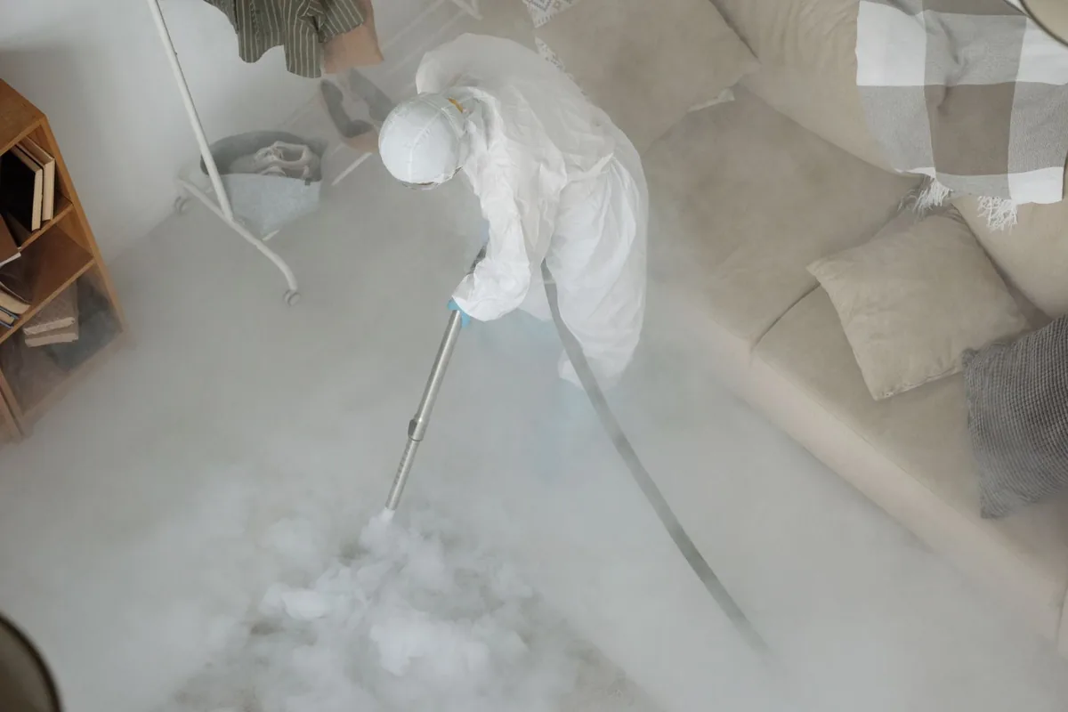 Biohazard cleanup technician in protective equipment, Ault, CO